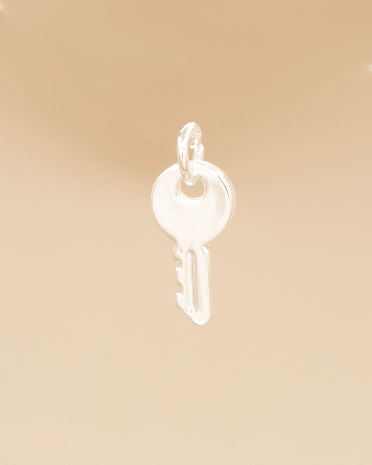 DIJE LLAVE BAÑO EN PLATA