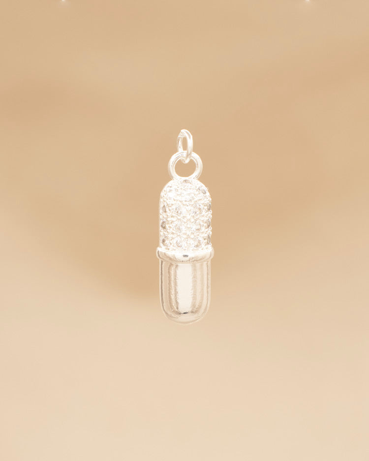 DIJE PILDORA BAÑO EN PLATA