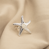 ANILLO ESTRELLA CON PERLA BAÑO DE PLATA