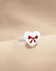 ANILLO CORAZON CON MOÑO BAÑO DE PLATA