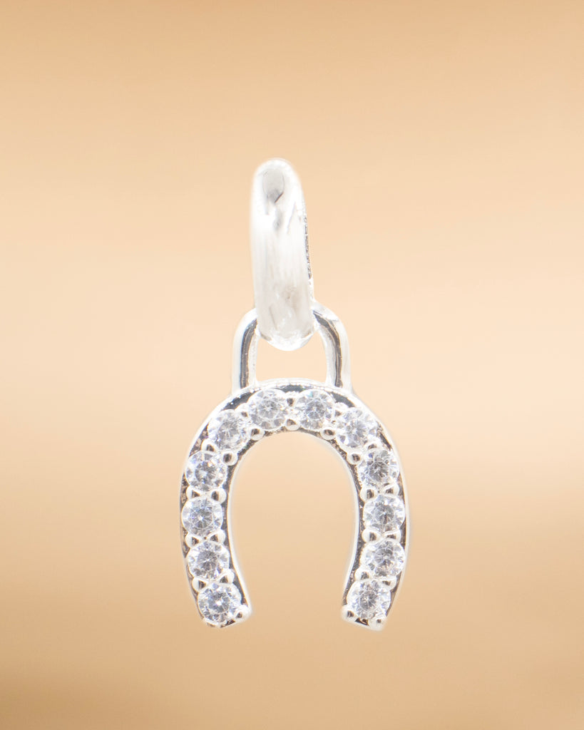 DIJE HERRADURA CIRCONADA BAÑO EN PLATA