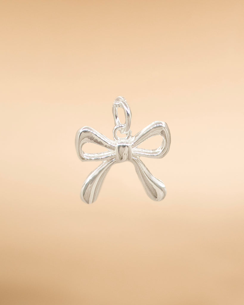 DIJE MOÑO LISO BAÑO EN PLATA