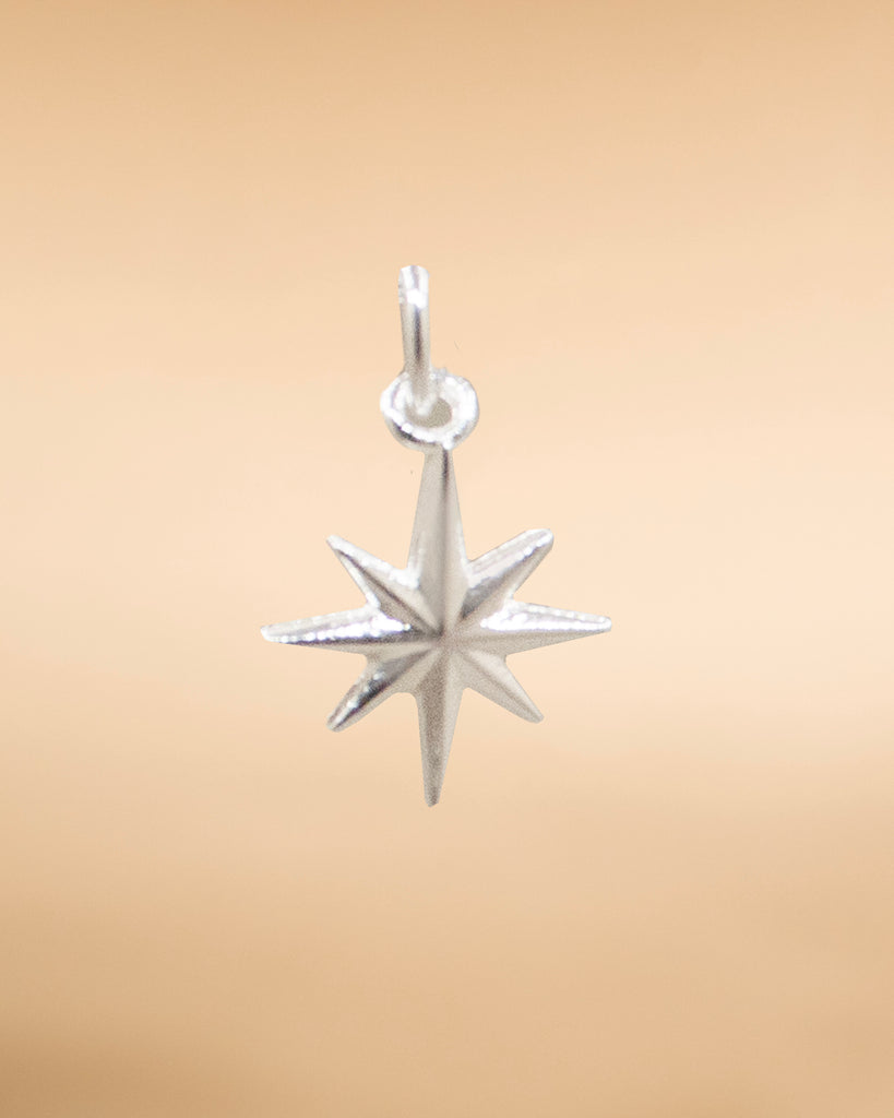 DIJE ESTRELLA BAÑO EN PLATA